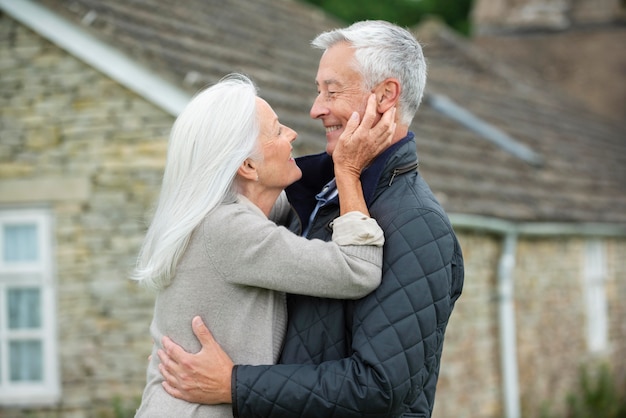 Free photo adorable senior couple looking at each other in an affectionate way