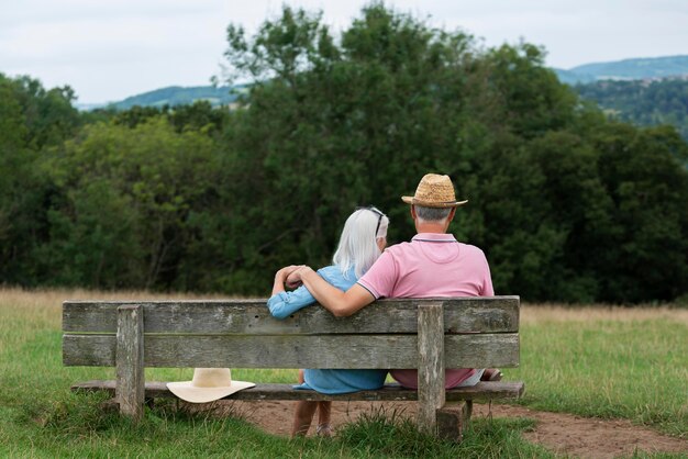 Adorable senior couple sitting on a bench