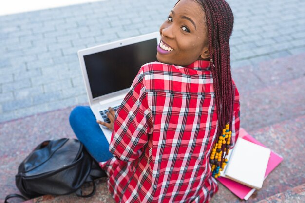 Free photo adorable student with computer