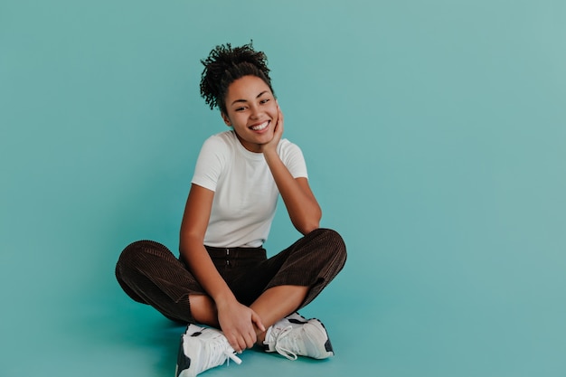 Adorable woman sitting with crossed legs