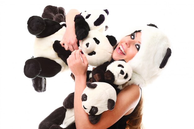 Adorable woman with lots of stuffed pandas