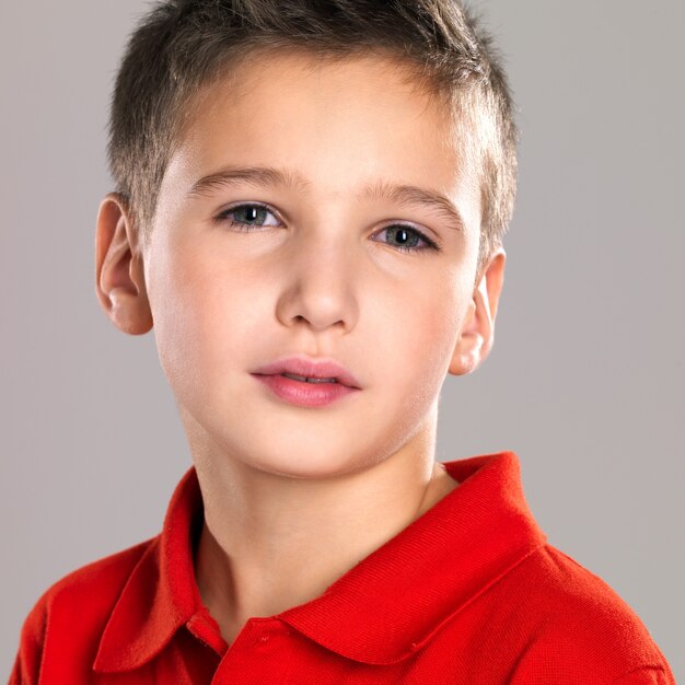 Adorable young beautiful boy posing