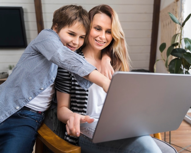 Adorable young boy happy to be with mom