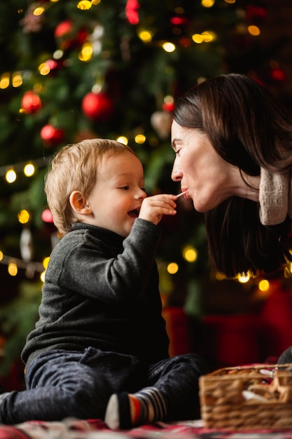 Adorable young boy playing with christmas toys