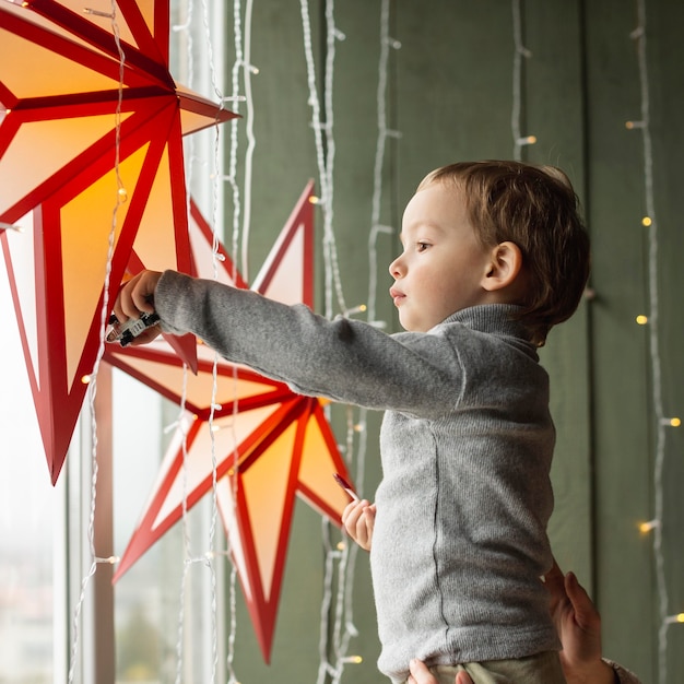 Adorable young boy playing with toys