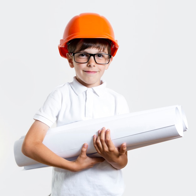 Adorable young boy with glasses and helmet