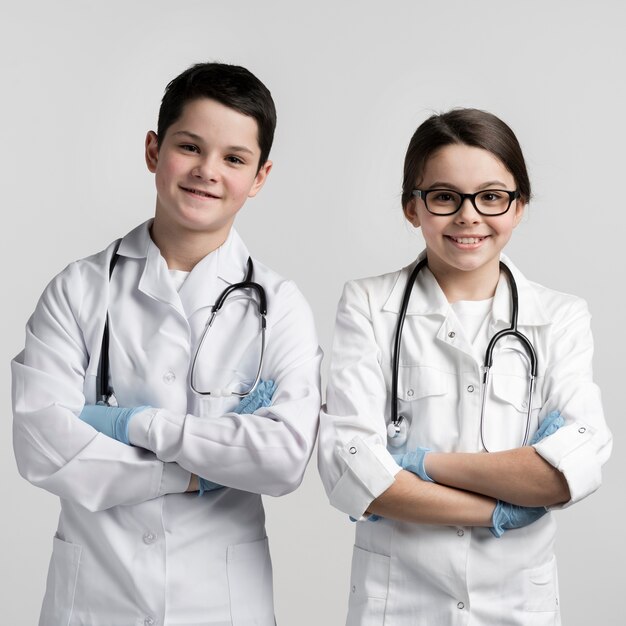 Adorable young children dressed up as doctors