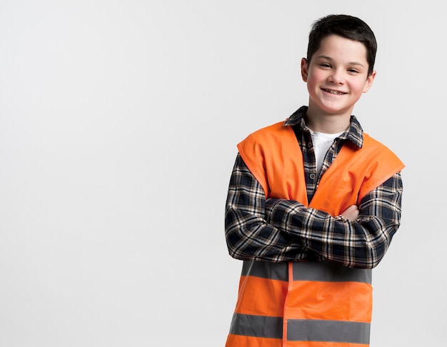 Adorable young construction specialist with vest