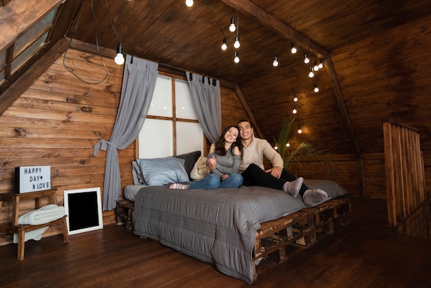 Free photo adorable young couple in the bed