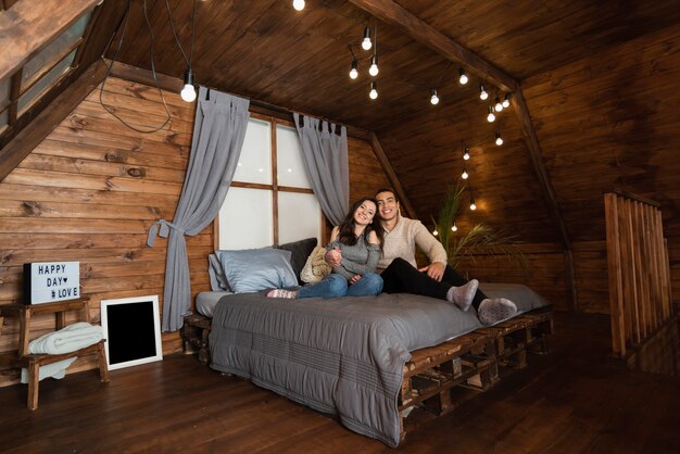 Adorable young couple in the bed