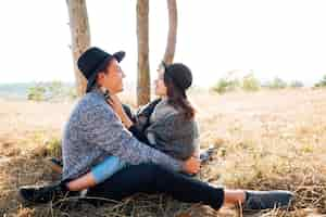 Free photo adorable young couple together in the nature