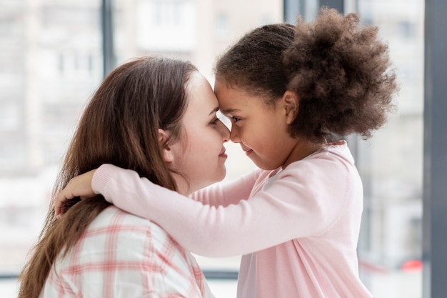 Adorable young girl happy to be home with mother