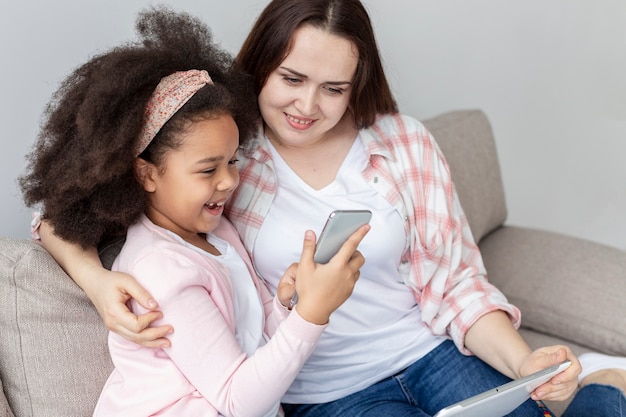 Adorable young girl happy to be home with mother