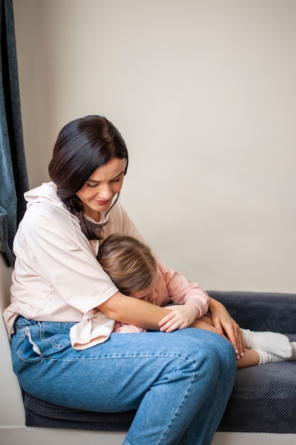 Free photo adorable young girl and mother together