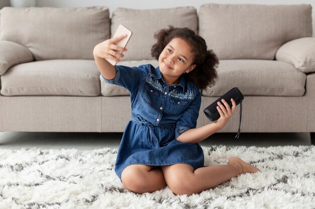 Adorable young girl taking a selfie