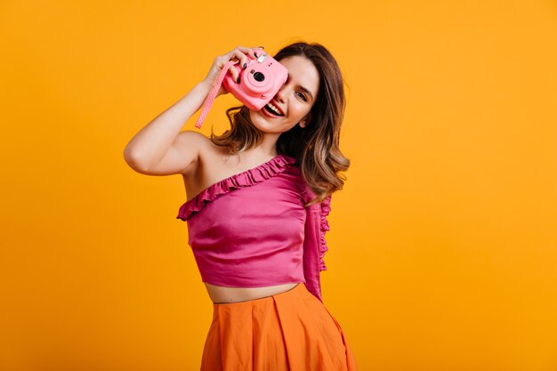 Adorable young photographer having fun