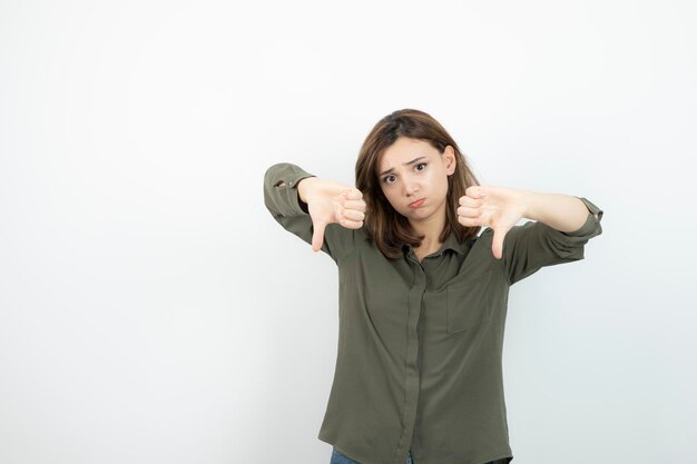 Adorable young woman in casual outfit standing and posing. High quality photo