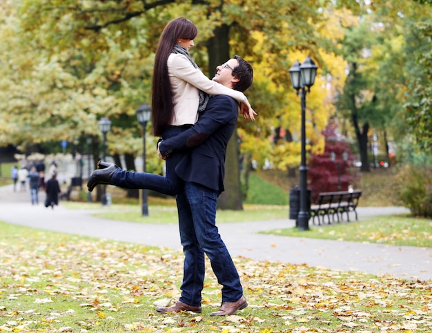 Adult couple having a good family day in the park