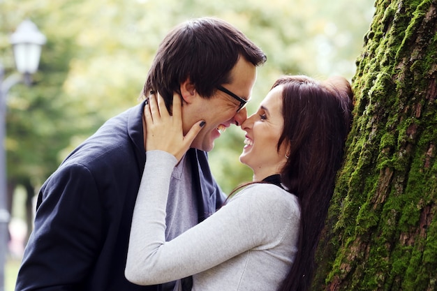 Adult couple having a good family day in the park