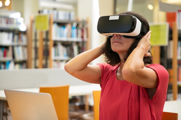 Adult female student excited with virtual presentation