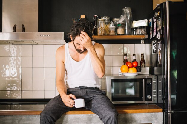 Free photo adult handsome man on counter