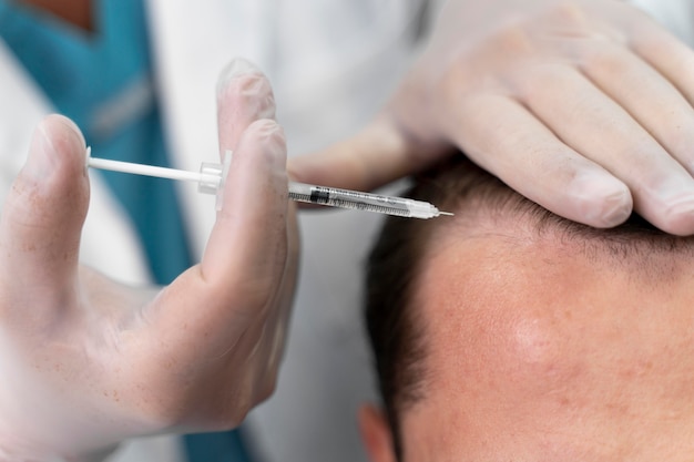 Adult male doing a follicular unit extraction