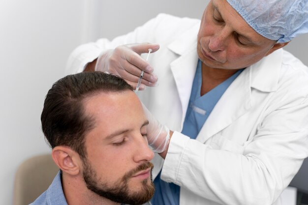 adult male doing a follicular unit extraction