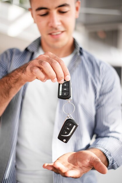 Adult male holding car keys