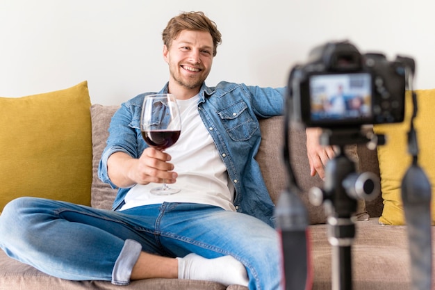 Free photo adult male recording himself at home