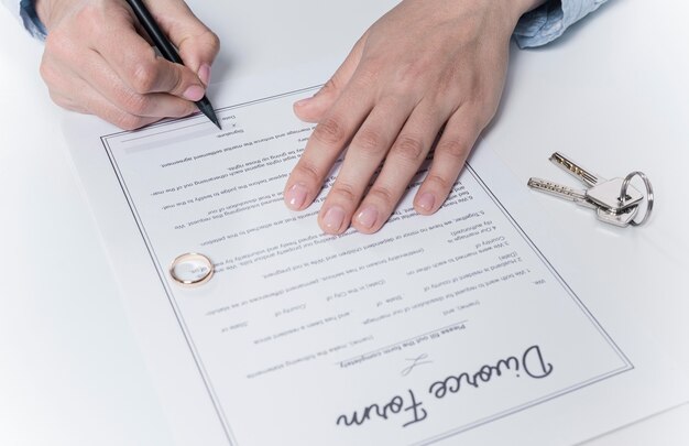 Adult male signing divorce form