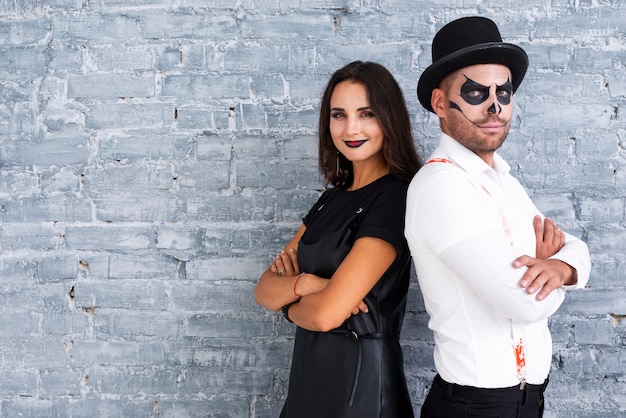 Free photo adult male and woman dressed for halloween