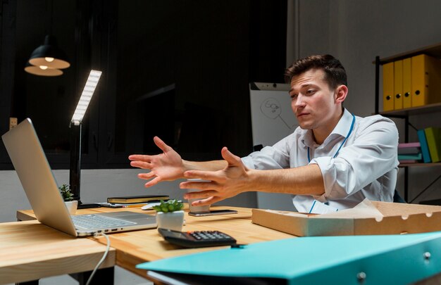 Adult male working on laptop at night