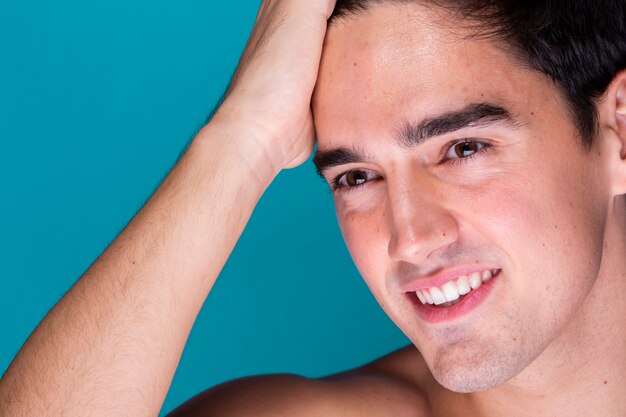 adult man grooming hair close-up