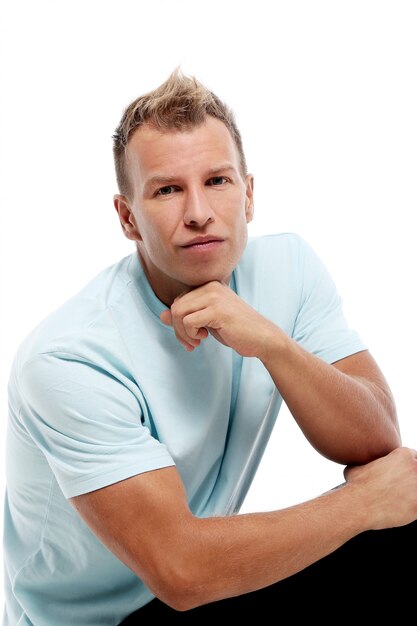 Adult man with a shirt posing in studio