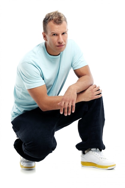 Free photo adult man with a shirt posing in studio