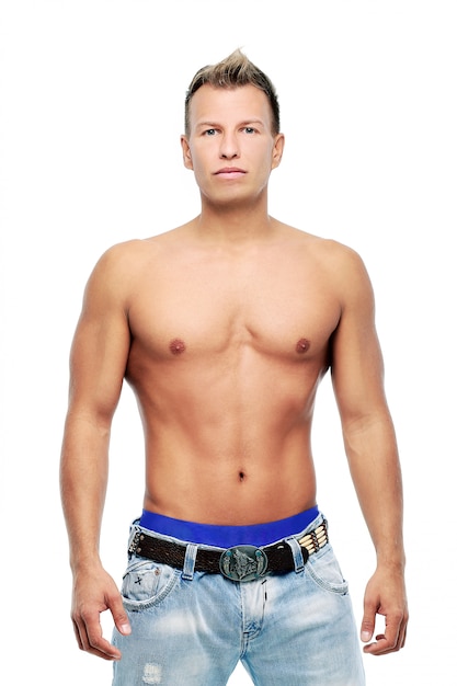 Adult man without shirt posing in studio