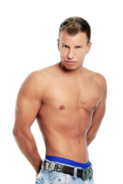 Adult man without shirt posing in studio