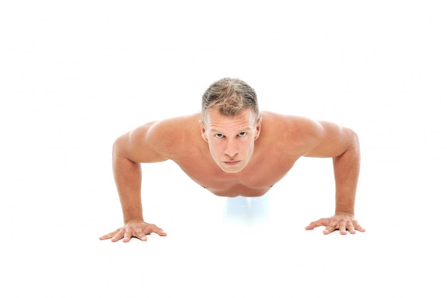 Adult man without shirt posing in studio