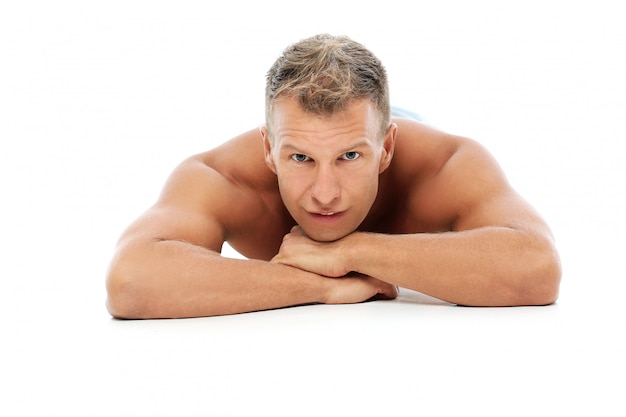 Adult man without shirt posing in studio