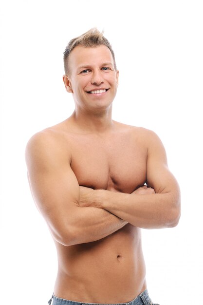 Adult man without shirt posing in studio