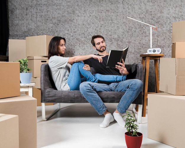 Adult man and woman planning relocation together
