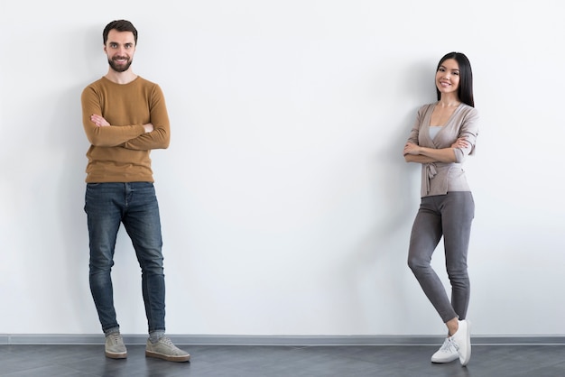 Adult man and woman posing together