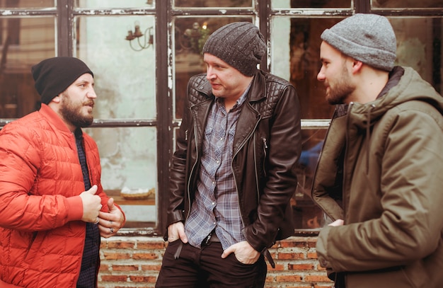 adult men talk sit together friends