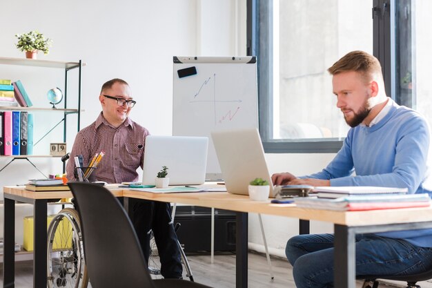 Adult men working together at the office