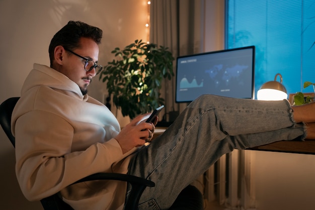 Free photo adult person working at home late at night