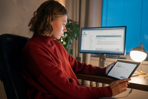 Free photo adult person working at home late at night