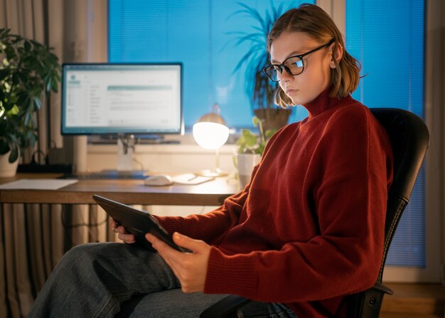 Adult person working at home late at night