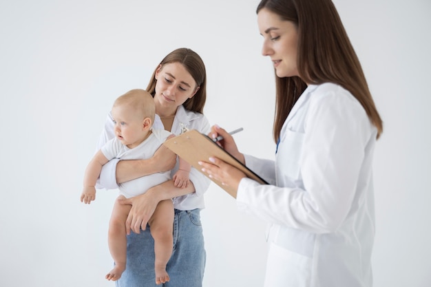 Free photo adult taking care of baby weight