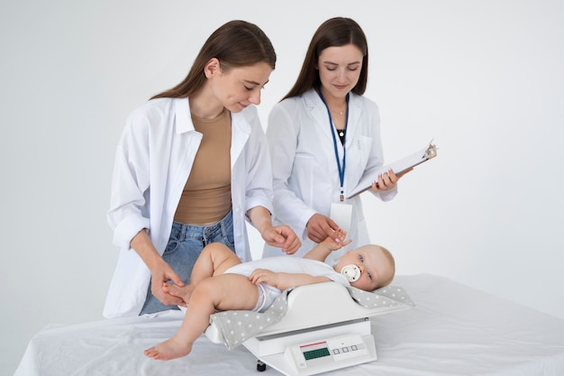 adult taking care of baby weight