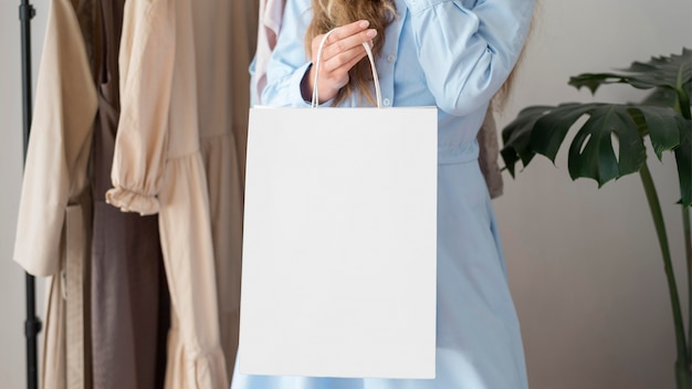 Adult woman carrying shopping bag